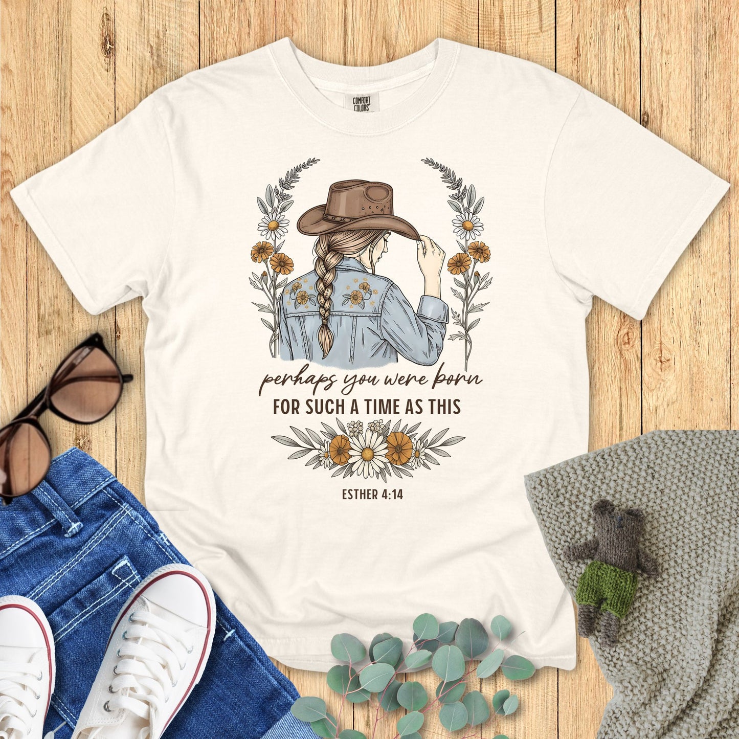 Western-style Christian shirt with woman in cowboy hat, floral accents, and text βPerhaps you were born for such a time as this β Esther 4:14.β