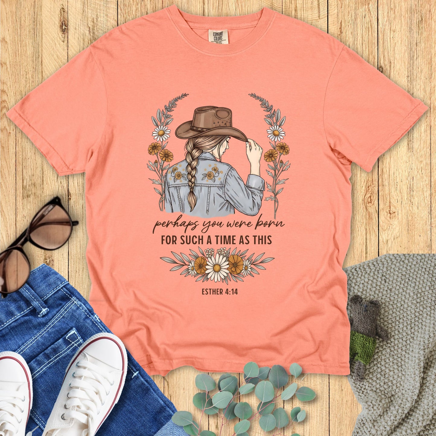Western-style Christian shirt with woman in cowboy hat, floral accents, and text βPerhaps you were born for such a time as this β Esther 4:14.β