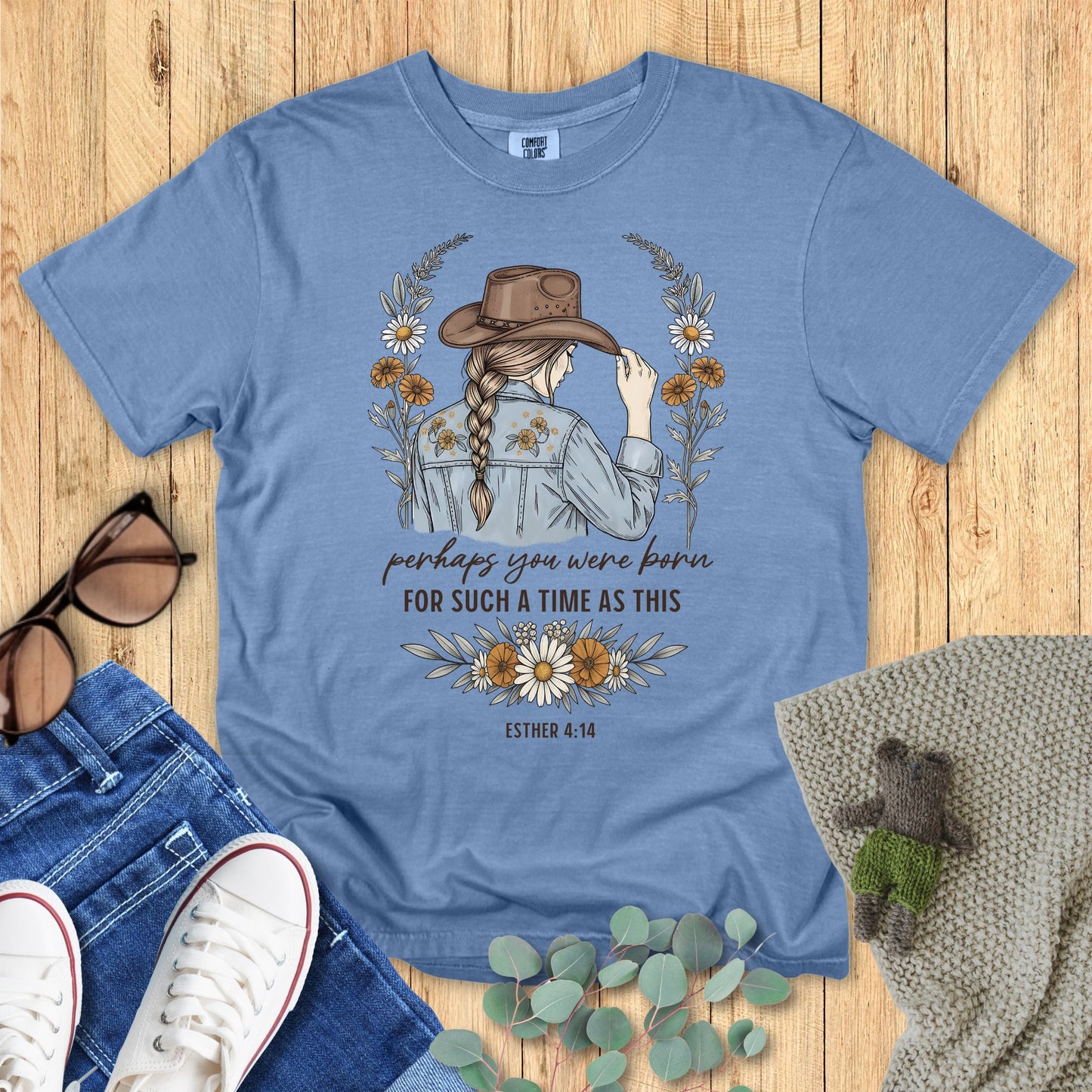 Western-style Christian shirt with woman in cowboy hat, floral accents, and text βPerhaps you were born for such a time as this β Esther 4:14.β