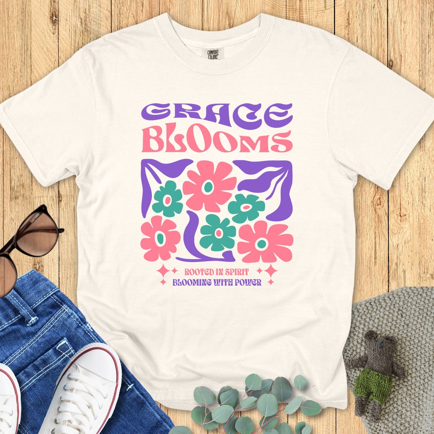ivory Comfort Colors 1717 Christian women's t-shirt with “Grace Blooms” floral graphic and “Rooted in Spirit Blooming with Power” text, faith-based inspirational shirt.