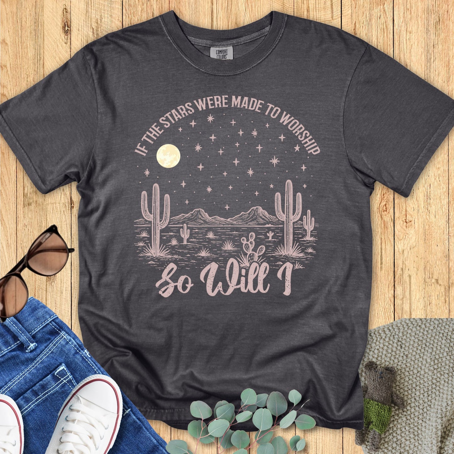 Christian women’s t-shirt on Comfort Colors 1717 in pepper gray featuring hand-drawn desert landscape with cacti, moon, and stars, reading 'If the stars were made to worship so will I