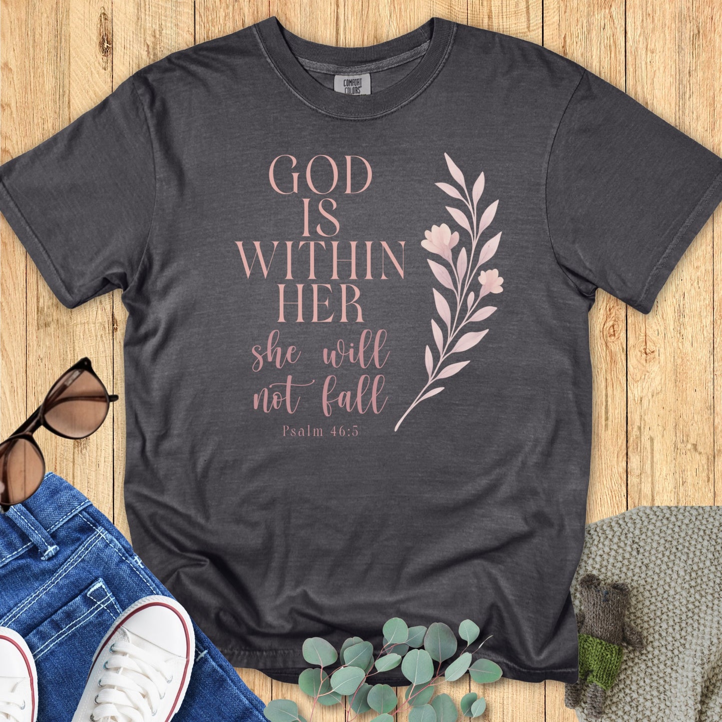 Comfort Colors 1717 pepper “God Is Within Her – Psalm 46:5” t-shirt with blush floral artwork. A soft and stylish faith-based apparel for women, perfect for daily encouragement and Christian mom gift ideas.