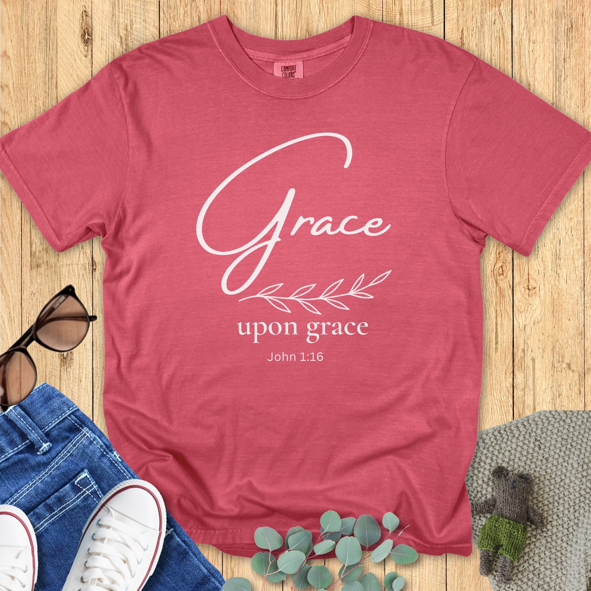 Comfort Colors 1717 crimson “Grace Upon Grace – John 1:16” t-shirt with white script and leaf accent. A stylish modern Christian shirt that blends simplicity and faith, perfect for Christian mom gift ideas.