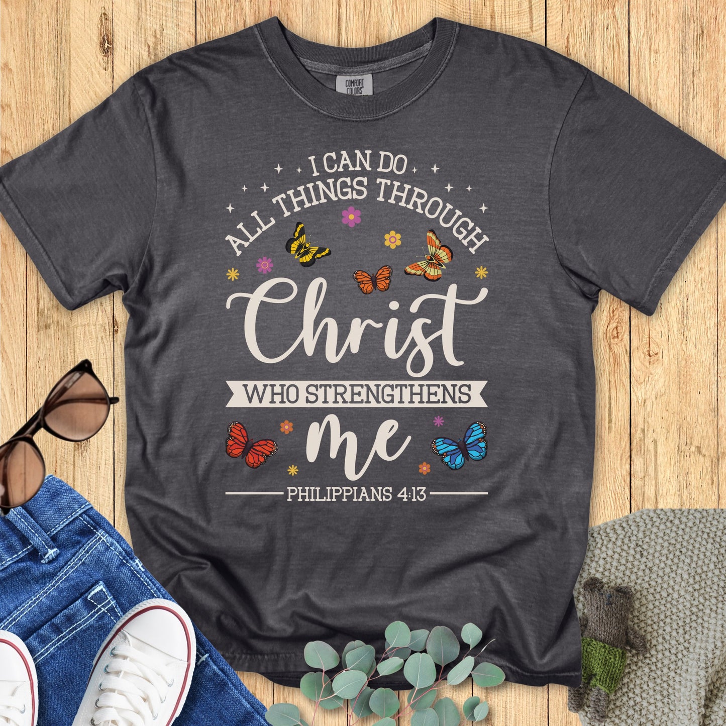 Comfort Colors 1717 pepper “I Can Do All Things Through Christ Who Strengthens Me – Philippians 4:13” t-shirt featuring butterfly illustrations and hand-lettered scripture. A timeless piece of faith-based apparel for women and thoughtful Christian mom gift.