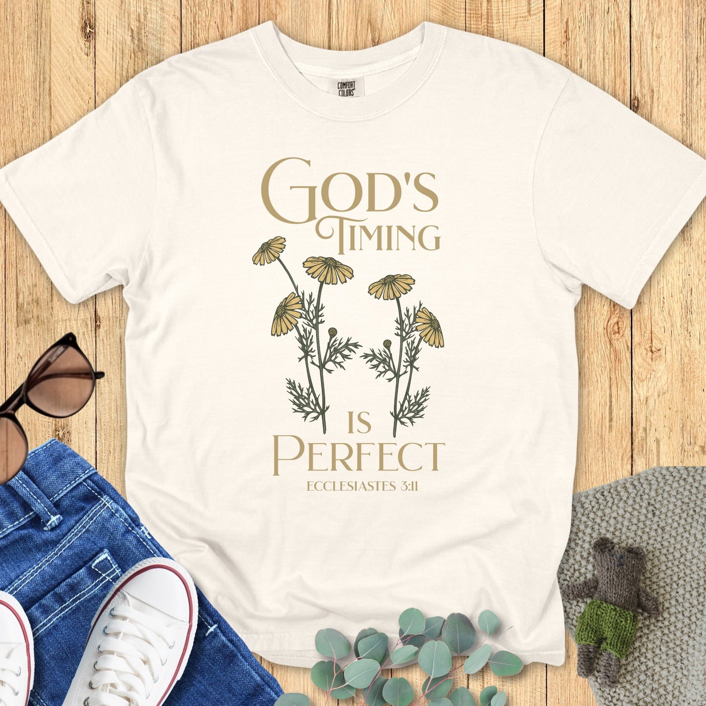 Comfort Colors 1717 ivory “God’s Timing Is Perfect – Ecclesiastes 3:11” t-shirt with minimalist wildflower illustration. A timeless women’s scripture tee — classic modern Christian shirt and faith-based apparel for women, perfect for gifting to moms or believers.
