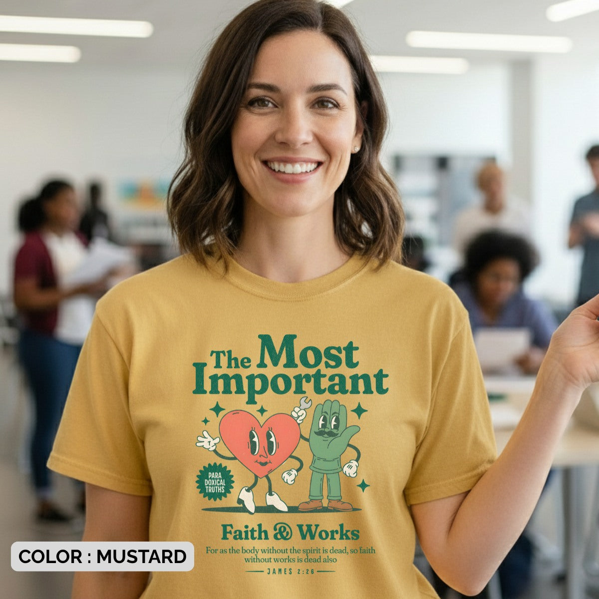 Woman wearing a Comfort Colors 1717 mustard “Faith & Works” t-shirt with heart and hand characters and James 2:26 scripture. A playful women’s scripture tee - faith-based apparel for women and modern Christian shirt, uplifting Christian mom gift idea for daily encouragement.
