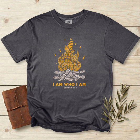 Christian women tee featuring “I Am Who I Am” Exodus 3:14 flame typography design printed on a Comfort Colors 1717 tshirt in Pepper. Faith-based Christian graphic tee for everyday US faith wear with modern, meaningful scripture art.