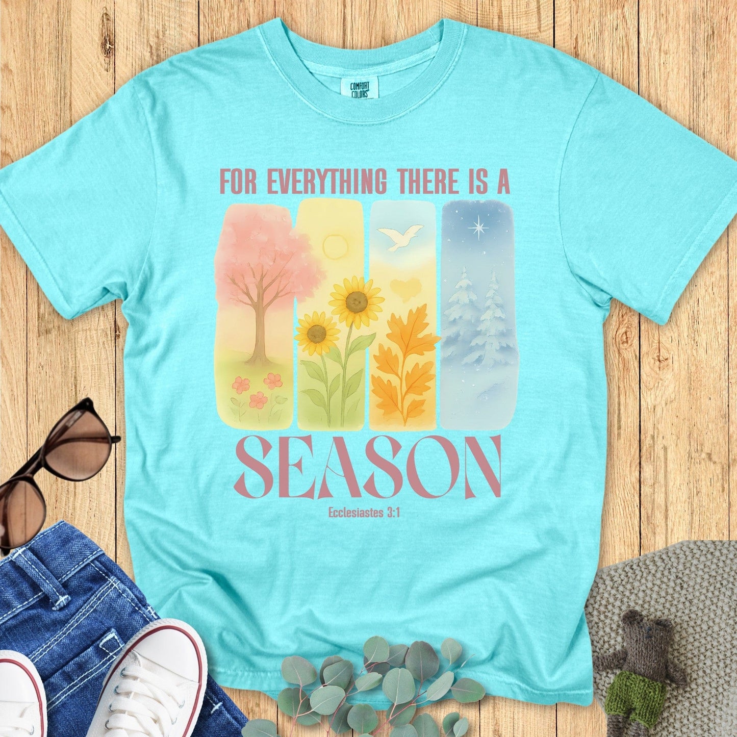 Flatlay of a Comfort Colors 1717 chalky mint “For Everything There Is a Season – Ecclesiastes 3:1” t-shirt featuring serene seasonal illustrations. A stylish women’s scripture tee that celebrates faith through every season of life.