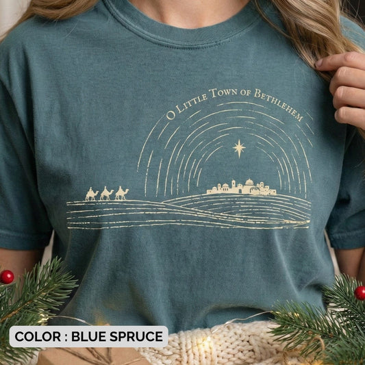 Comfort Colors 1717 blue spruce Christian women tee with a gold line-art Bethlehem design and the phrase “O Little Town of Bethlehem.” A cozy, garment-dyed US faith wear shirt perfect for celebrating the Christmas story with style and reverence.