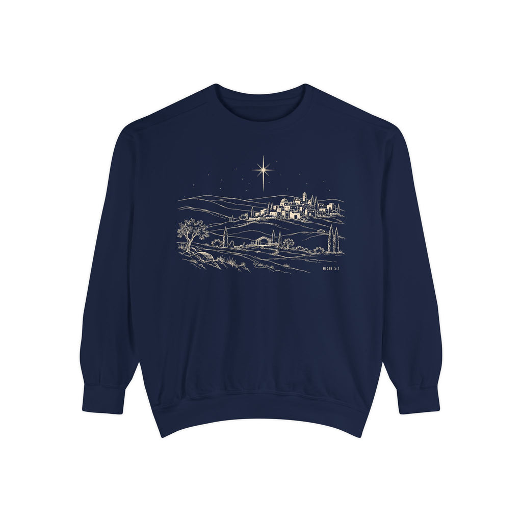 True Navy Christian Christmas sweatshirt with line art of Bethlehem on a hillside, a radiant star, an open stable and Micah 5:2.