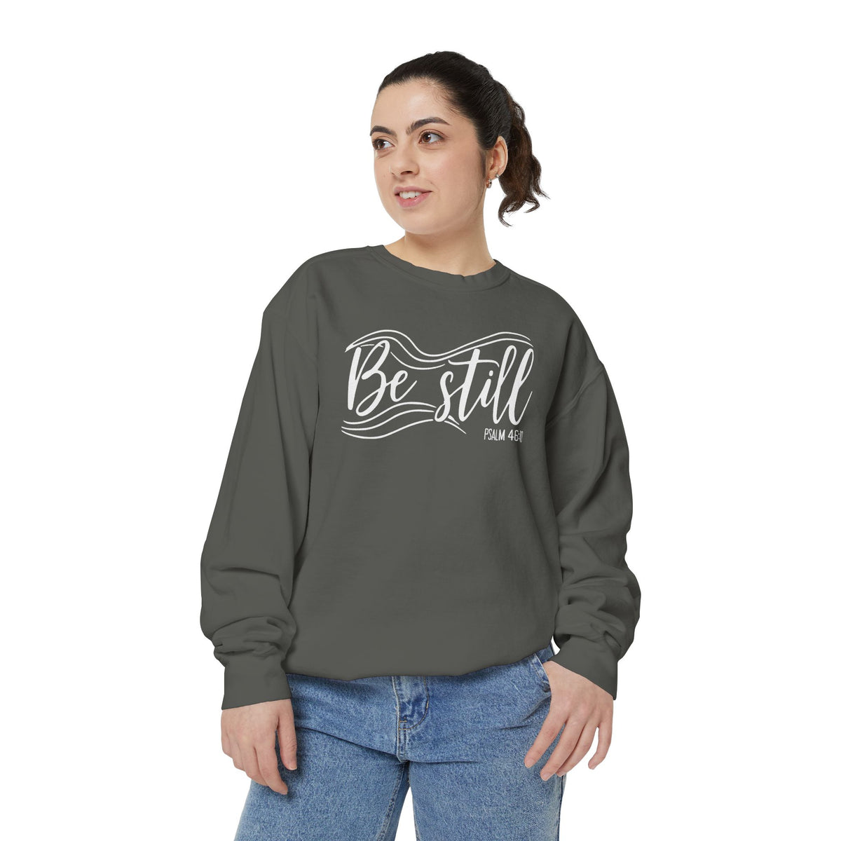 Christian sweatshirt reading Be still in flowing brush script with sweeping lines, Psalm 46:10