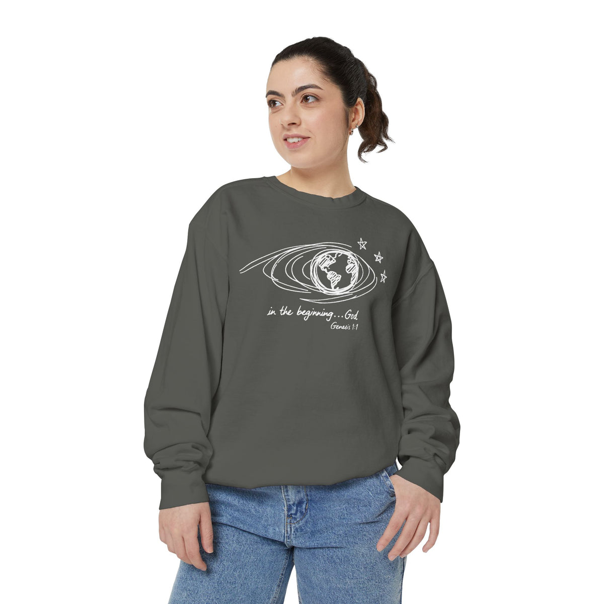 Christian sweatshirt with hand-sketched Earth, looping orbit lines and three stars, reading in the beginning God, Genesis 1:1