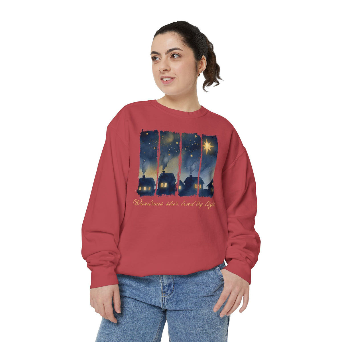 Christian Christmas sweatshirt with a painted village at night, glowing windows, a big golden star and Wondrous star, lend thy light in script.
