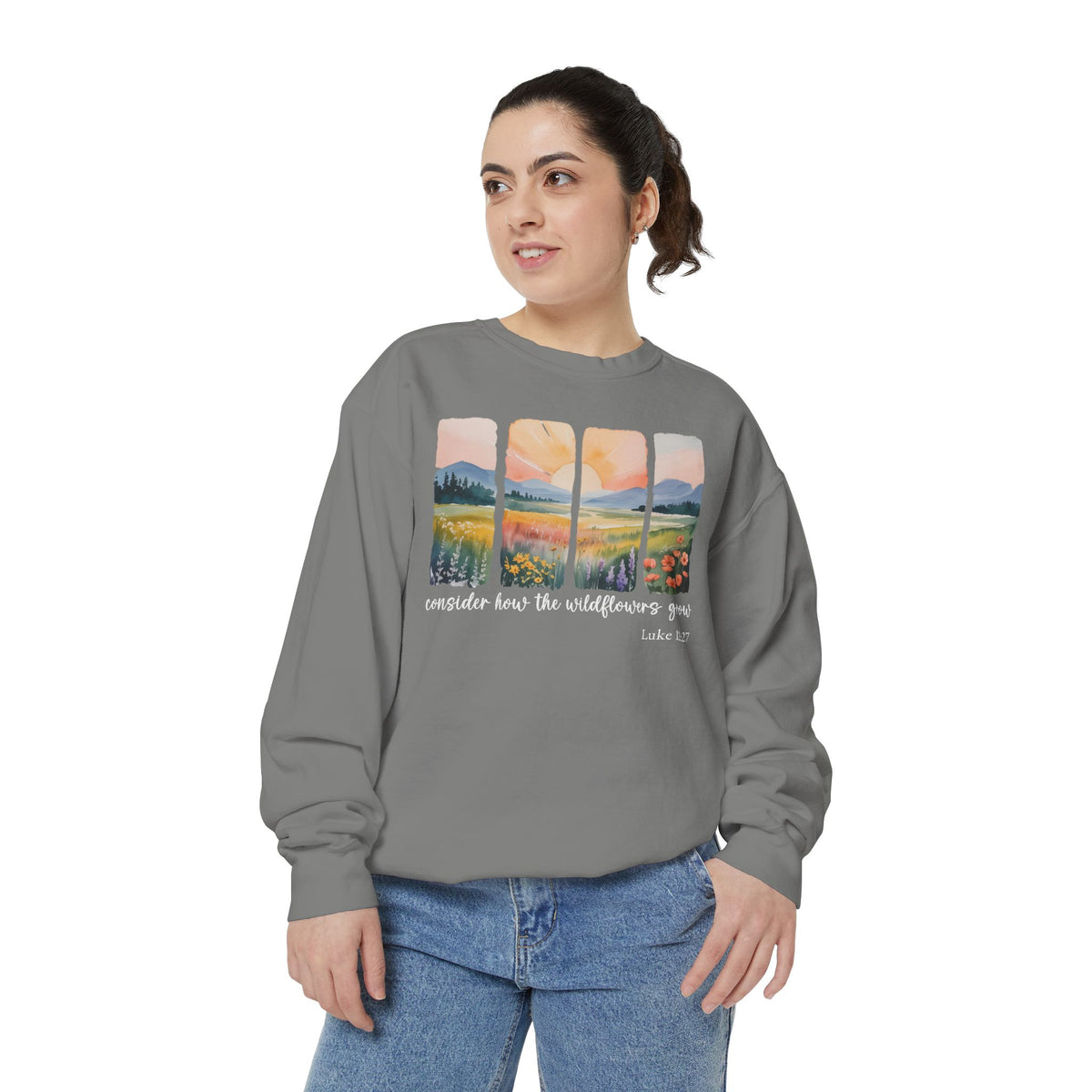 Christian sweatshirt with four painted panels of sunrise over hills and a wildflower meadow, reading consider how the wildflowers grow, Luke 12:27