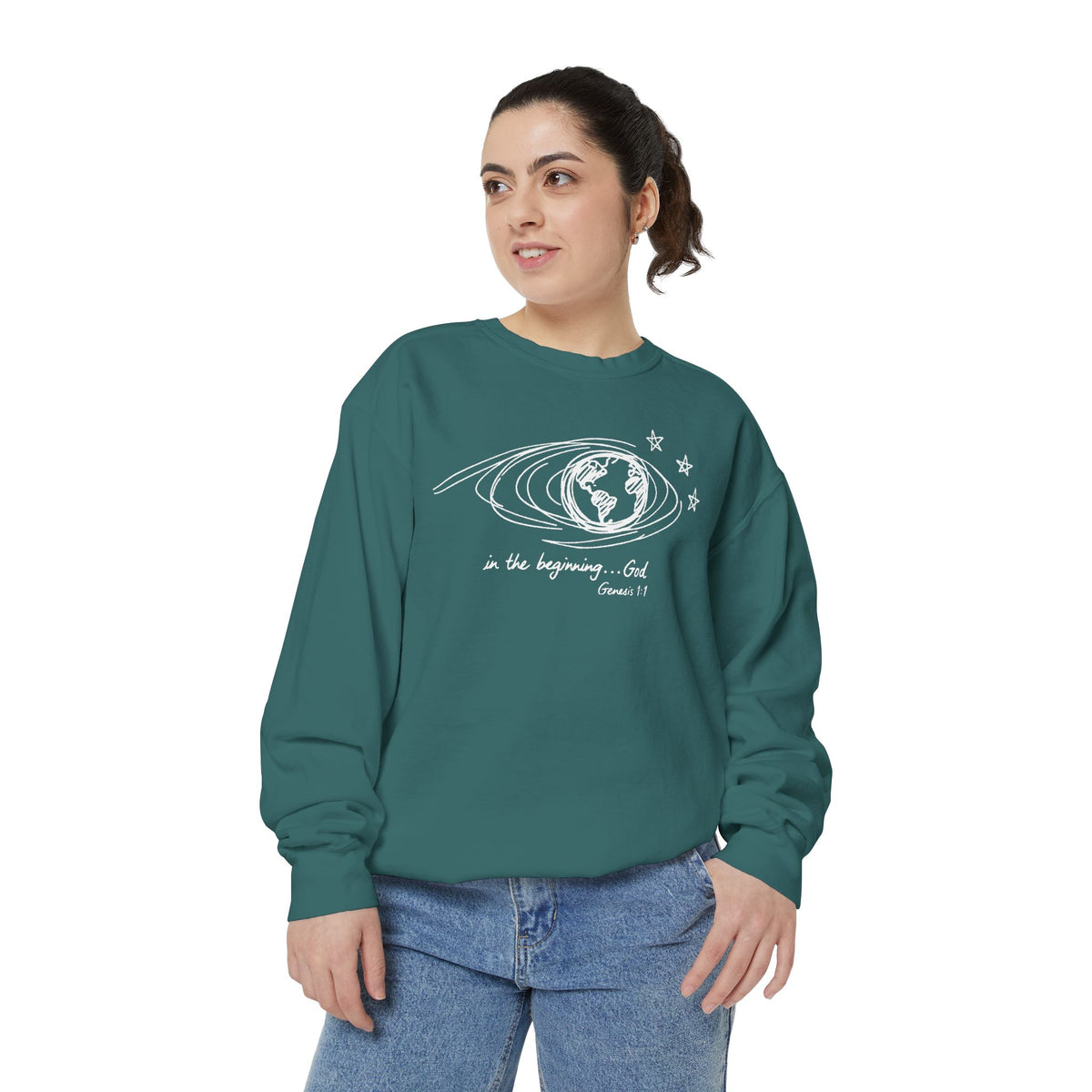Christian sweatshirt with hand-sketched Earth, looping orbit lines and three stars, reading in the beginning God, Genesis 1:1