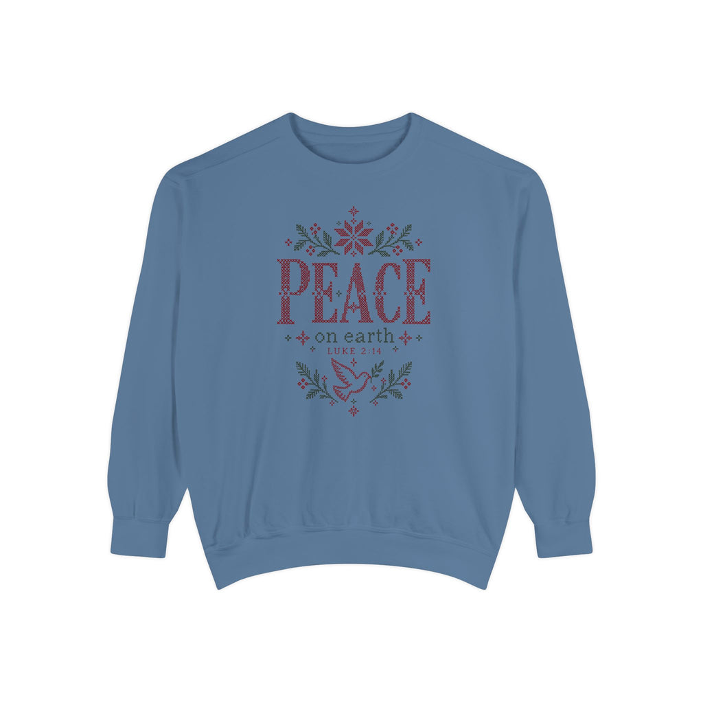 Blue Jean Christian Christmas sweatshirt with cross-stitch style Peace on Earth lettering, a dove, stars, branches and Luke 2:14.