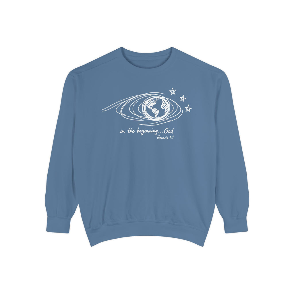 Blue Jean Christian sweatshirt with hand-sketched Earth, looping orbit lines and three stars, reading in the beginning God, Genesis 1:1
