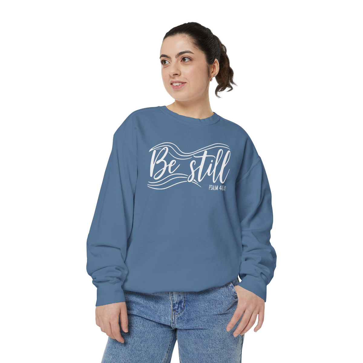 Christian sweatshirt reading Be still in flowing brush script with sweeping lines, Psalm 46:10