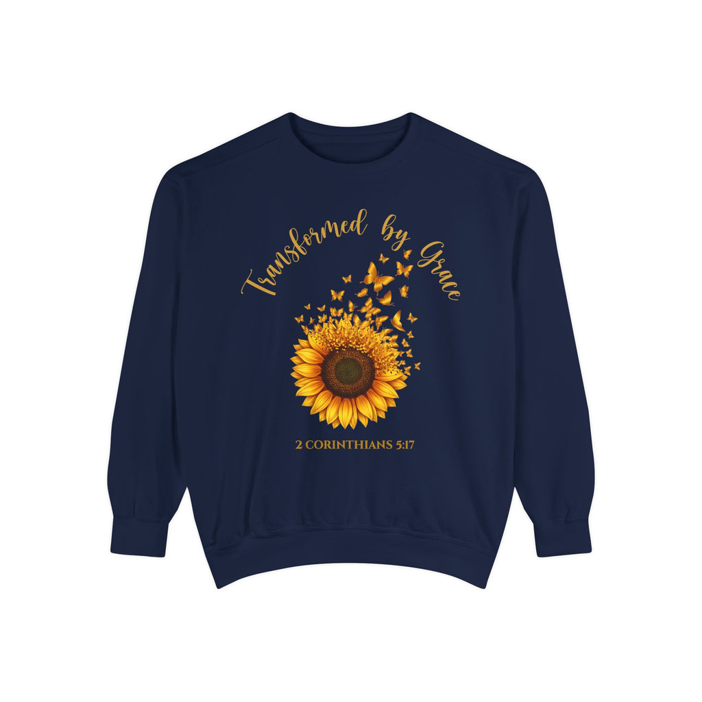 True Navy Christian sweatshirt with a painted sunflower whose petals turn into butterflies, reading Transformed by Grace, 2 Corinthians 5:17