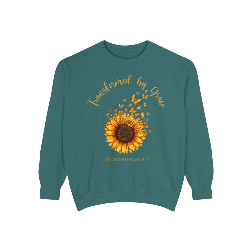 Blue Spruce Christian sweatshirt with a painted sunflower whose petals turn into butterflies, reading Transformed by Grace, 2 Corinthians 5:17