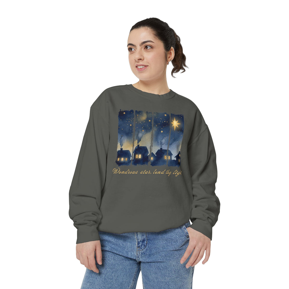 Christian Christmas sweatshirt with a painted village at night, glowing windows, a big golden star and Wondrous star, lend thy light in script.