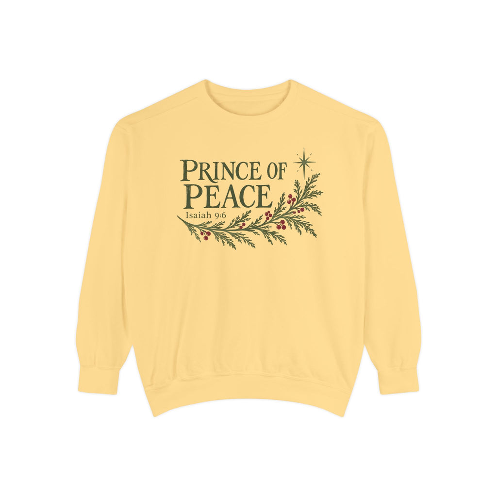 Butter Christian Christmas sweatshirt with Prince of Peace lettering, an evergreen branch with red berries, a star and Isaiah 9:6.