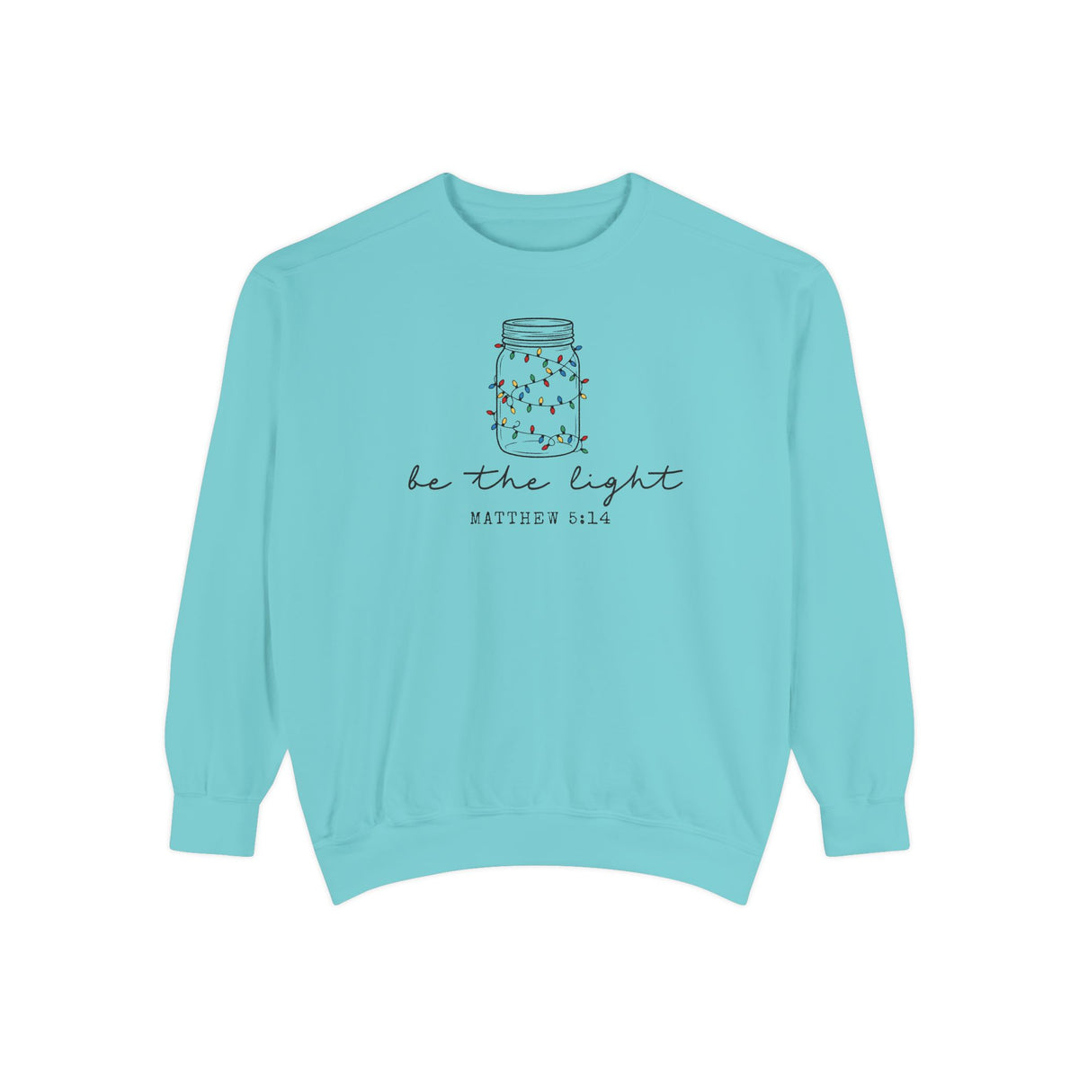 Chalky Mint Christian Christmas sweatshirt with a mason jar wrapped in Christmas lights, be the light script and Matthew 5:14.