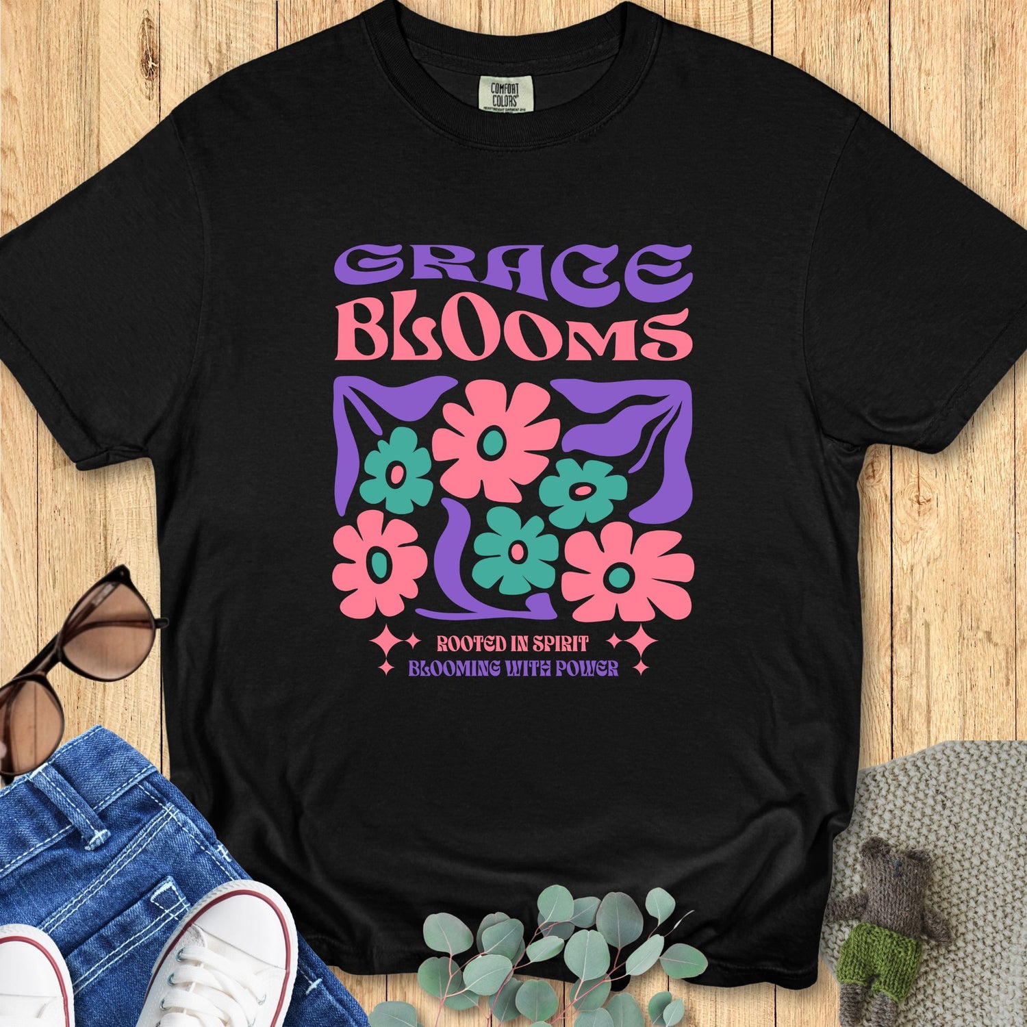 Black Comfort Colors 1717 Christian women's t-shirt with “Grace Blooms” floral graphic and “Rooted in Spirit Blooming with Power” text, boutique faith-based shirt.