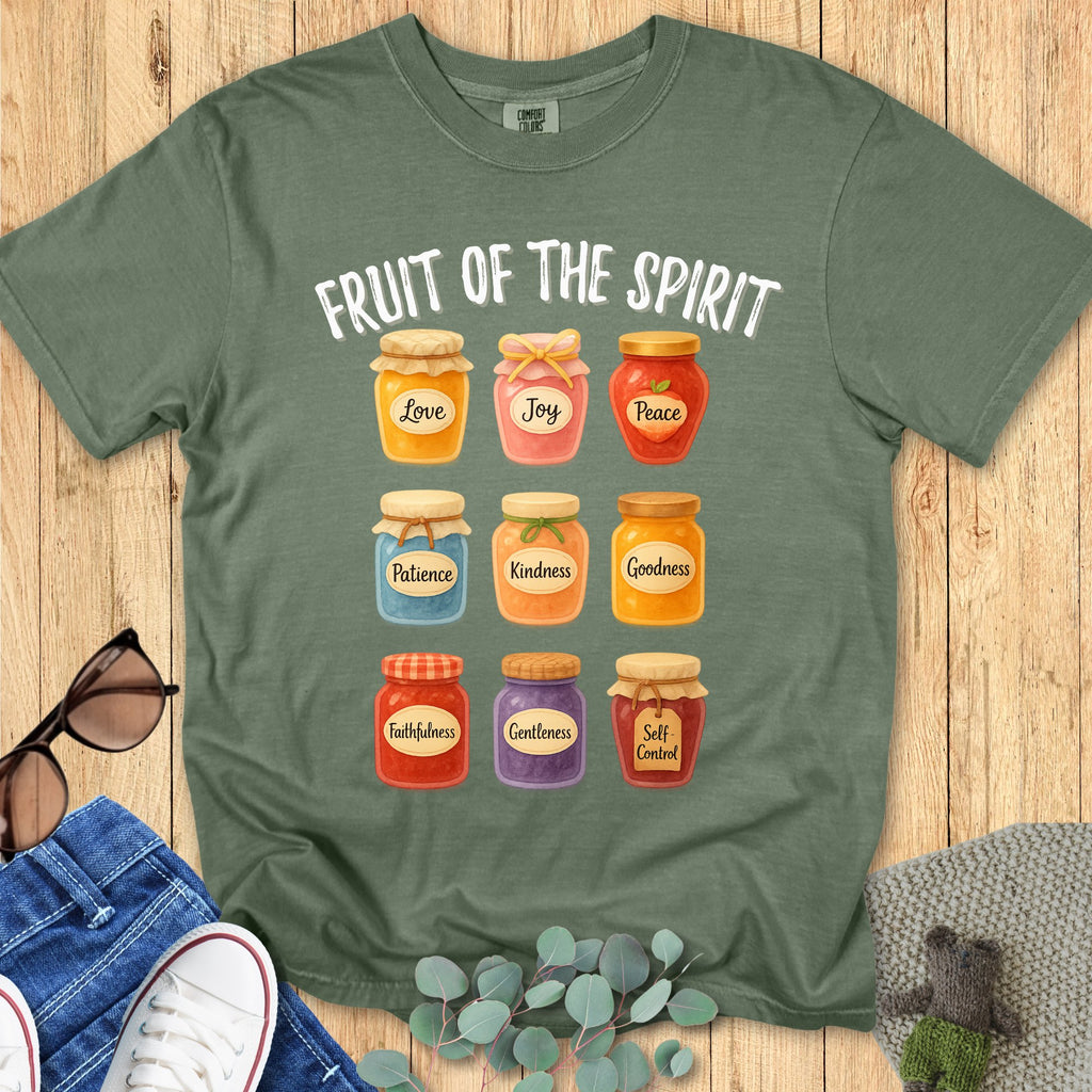 omfort Colors 1717 Christian women t-shirt in moss green flat lay. Fruit of the Spirit design with illustrated jars representing Love, Joy, Peace, Patience, Kindness, Goodness, Faithfulness, Gentleness, and Self-Contro