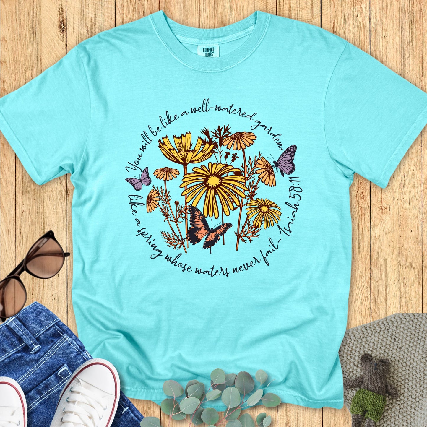 Christian Comfort Colors 1717 T-shirt in chalky mint, decorated with yellow flowers and butterflies around Isaiah 58:11 scripture tex
