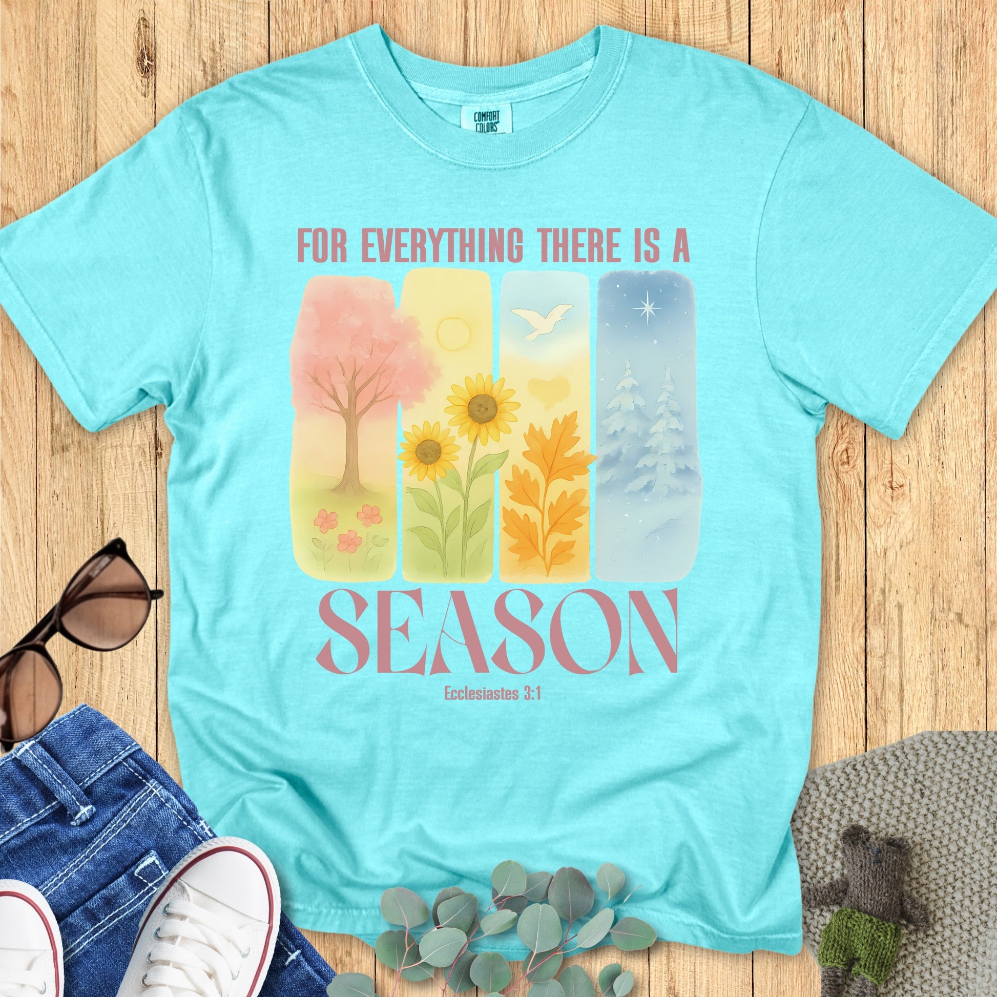 Flatlay of a Comfort Colors 1717 chalky mint “For Everything There Is a Season – Ecclesiastes 3:1” t-shirt featuring serene seasonal illustrations. A stylish women’s scripture tee that celebrates faith through every season of life.