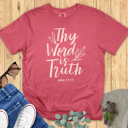 Flatlay of a Comfort Colors 1717 crimson “Thy Word Is Truth – John 17:17” t-shirt with hand-drawn leaf accents. A bold women’s scripture tee — modern faith-based apparel for women and thoughtful Christian mom gift idea inspired by John 17:17.