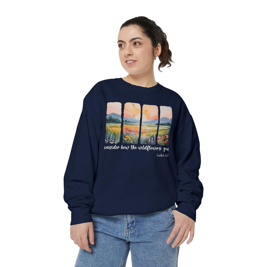 Christian sweatshirt with four painted panels of sunrise over hills and a wildflower meadow, reading consider how the wildflowers grow, Luke 12:27