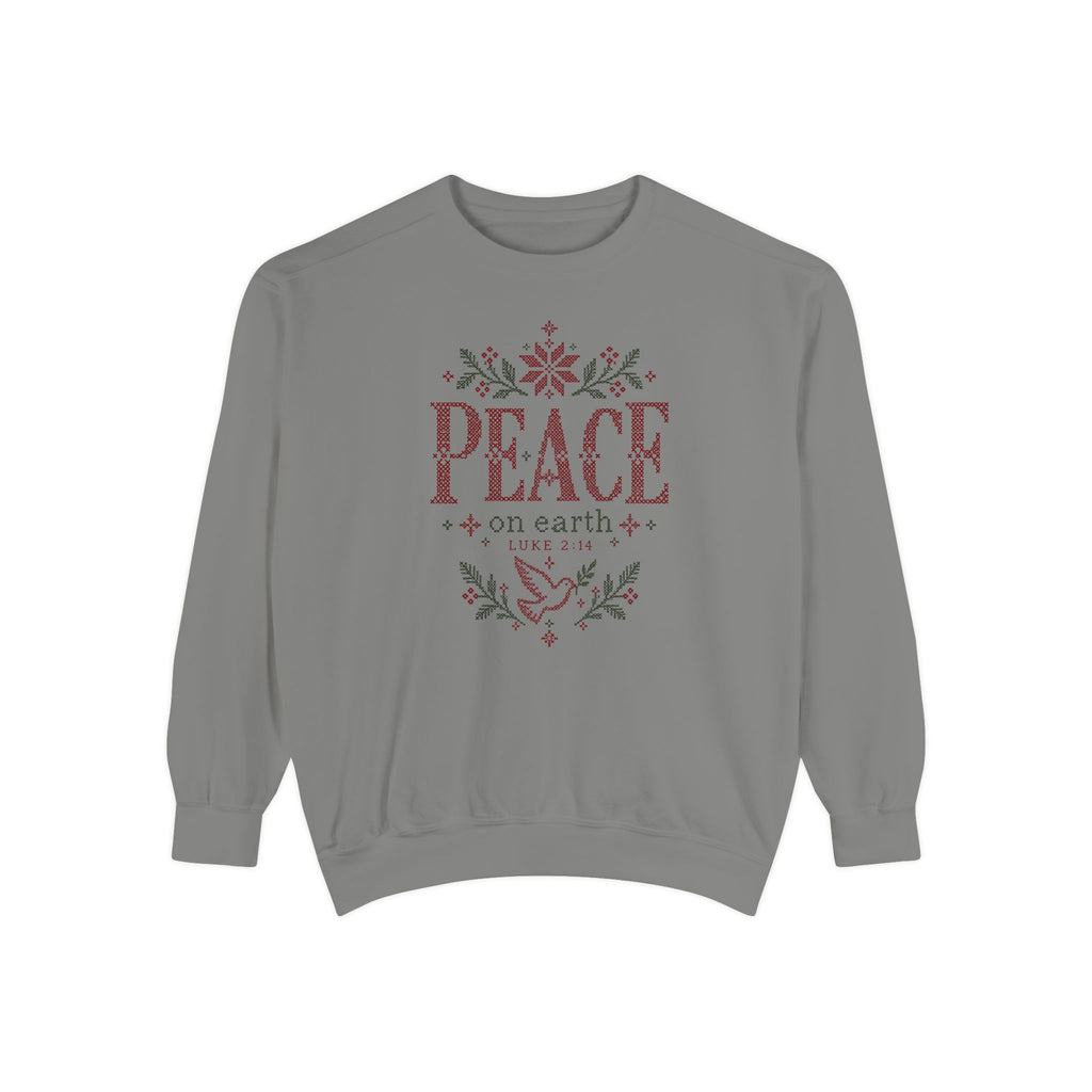 Grey Christian Christmas sweatshirt with cross-stitch style Peace on Earth lettering, a dove, stars, branches and Luke 2:14.