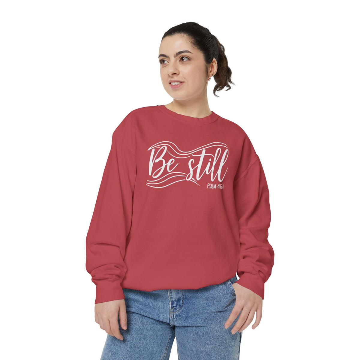 Christian sweatshirt reading Be still in flowing brush script with sweeping lines, Psalm 46:10