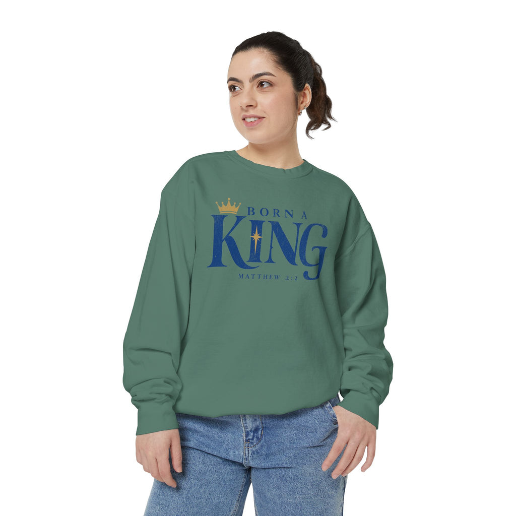Christian Christmas sweatshirt with Born a King lettering, a crown, a star and Matthew 2:2.