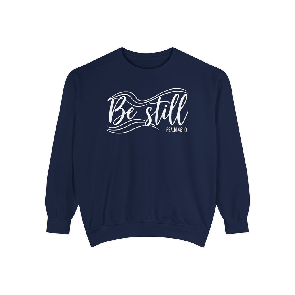 True Navy Christian sweatshirt reading Be still in flowing brush script with sweeping lines, Psalm 46:10