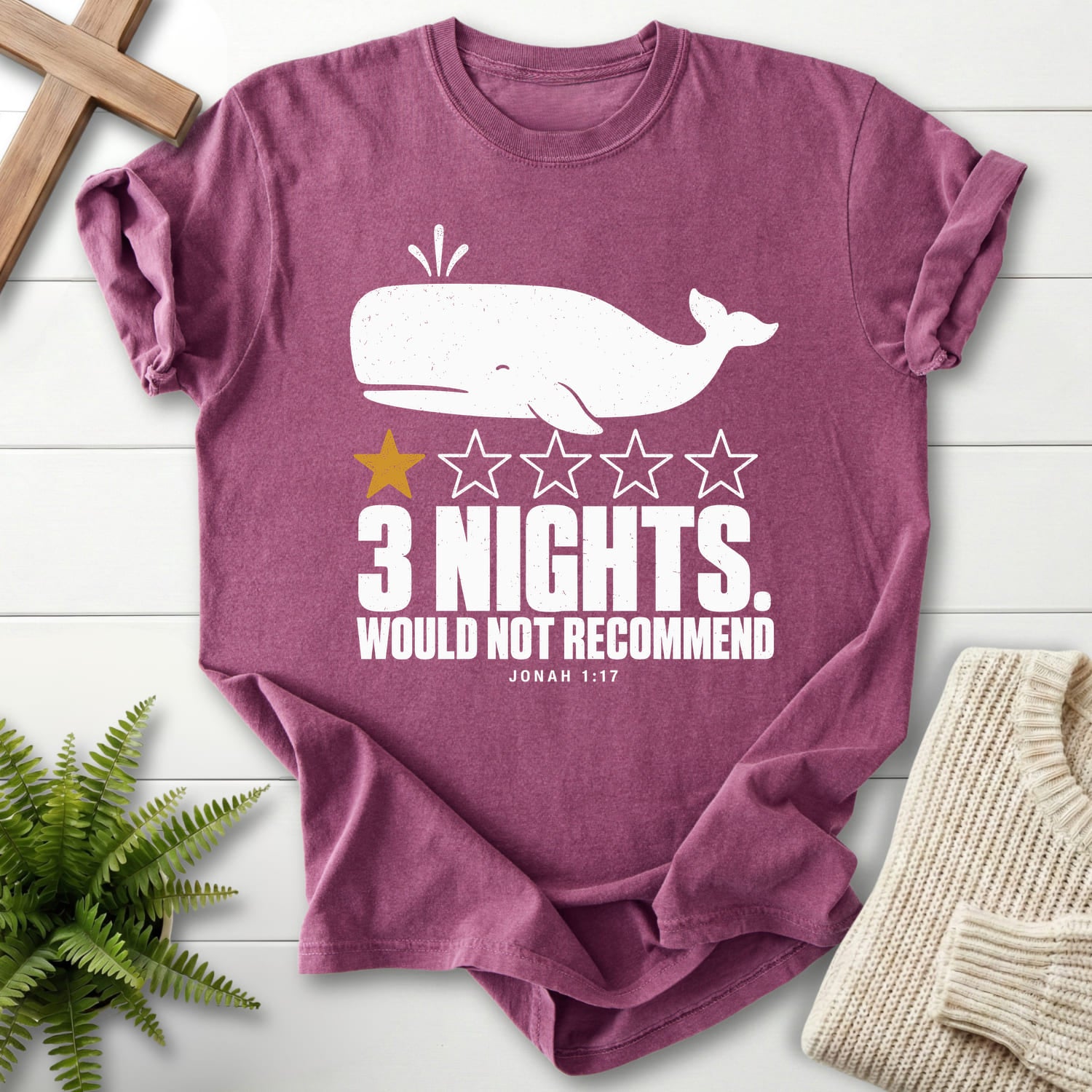 Flat lay of a Berry Christian graphic tee featuring minimal whale artwork with "3 Nights Jonah 1 17 Dark T-Shirt".