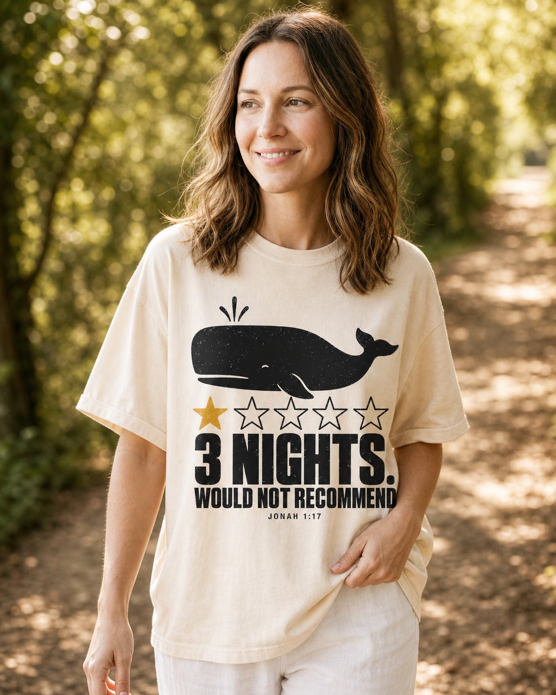 3 Nights Would Not Recommend – Ivory women's Christian tee, lifestyle photo in nature trail – Whale silhouette with a one-star review joke – Jonah 1:17 – She Wears Faith
