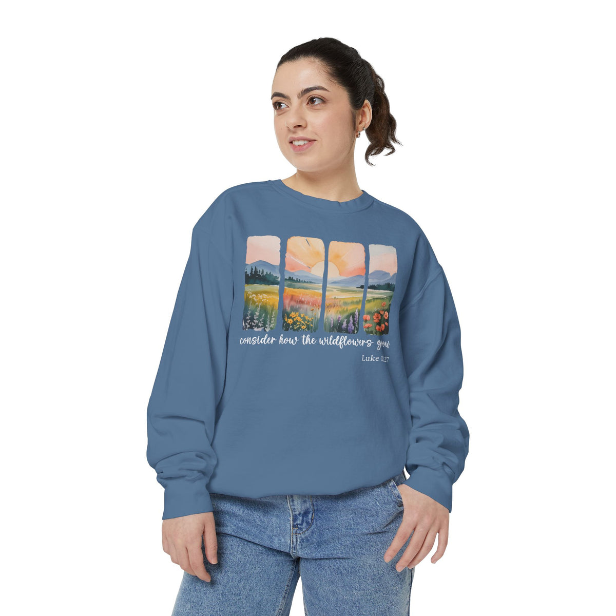 Christian sweatshirt with four painted panels of sunrise over hills and a wildflower meadow, reading consider how the wildflowers grow, Luke 12:27