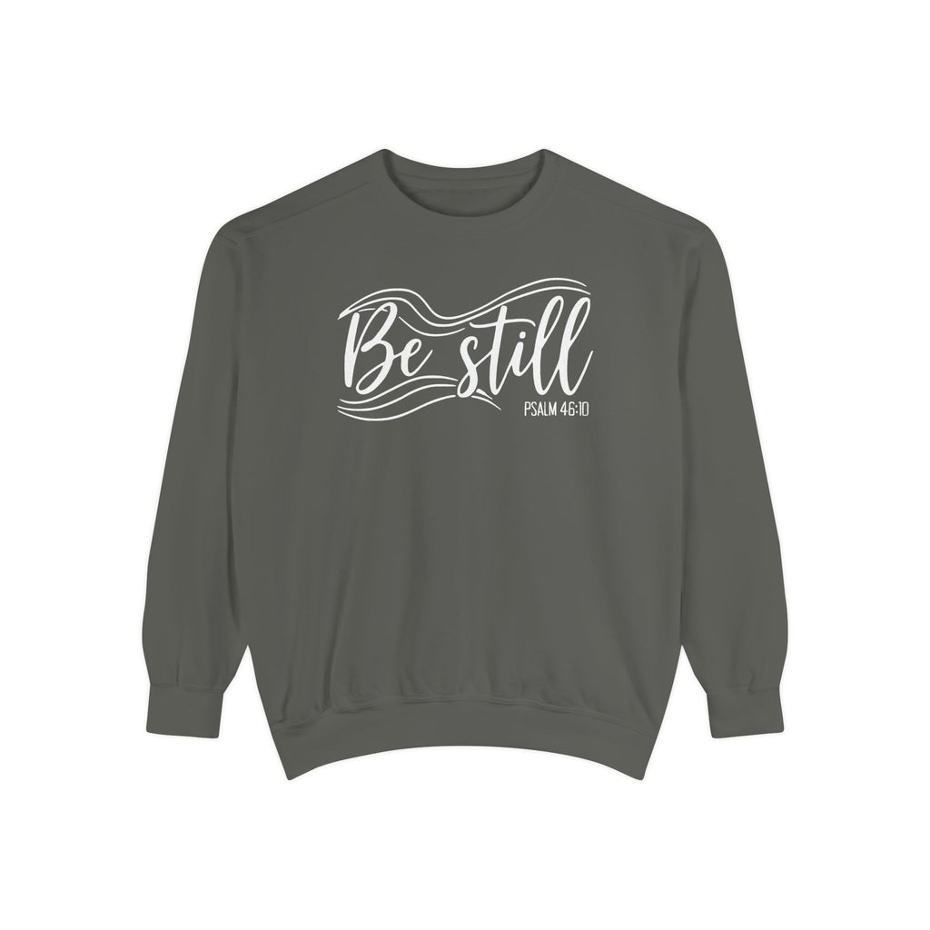 Pepper Christian sweatshirt reading Be still in flowing brush script with sweeping lines, Psalm 46:10