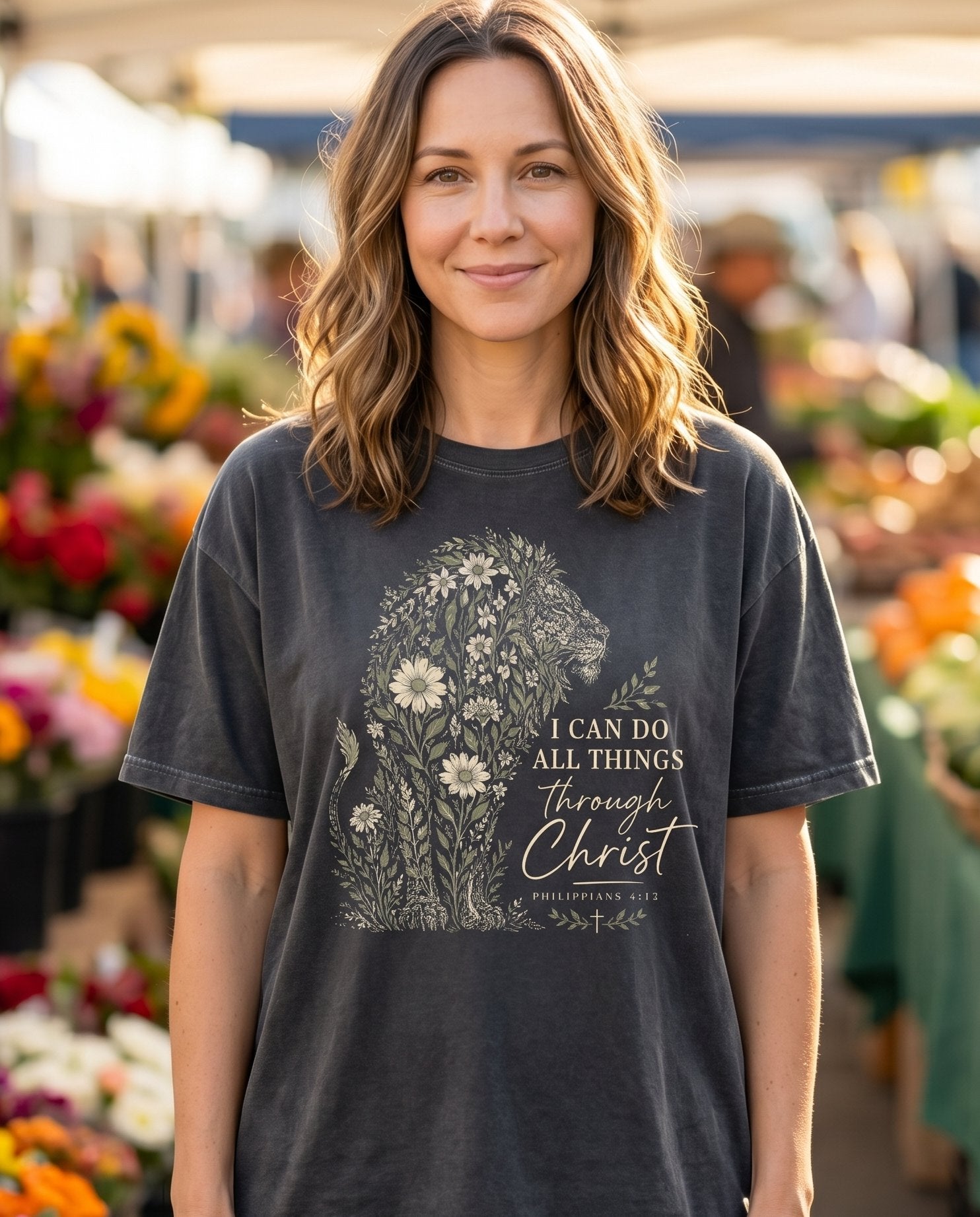 Flowery Lion Philippians 4:13 – Pepper women's Christian tee, lifestyle photo in farmers market – Colorful floral lion with flowers and botanical illustration – She Wears Faith