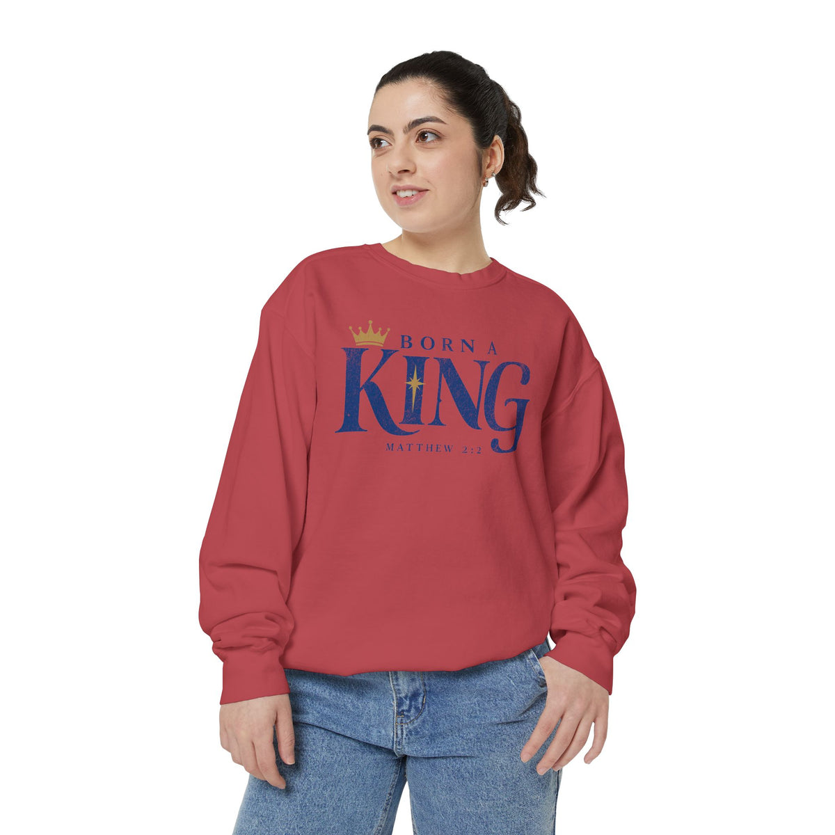 Christian Christmas sweatshirt with Born a King lettering, a crown, a star and Matthew 2:2.