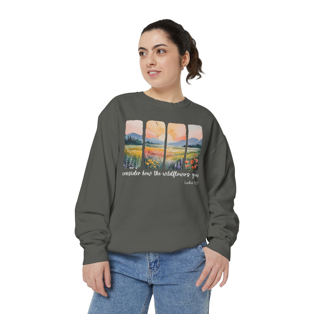 Christian sweatshirt with four painted panels of sunrise over hills and a wildflower meadow, reading consider how the wildflowers grow, Luke 12:27