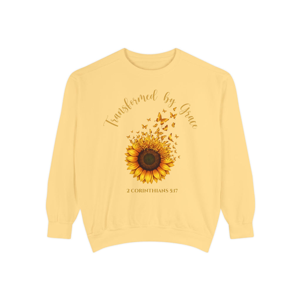 Butter Christian sweatshirt with a painted sunflower whose petals turn into butterflies, reading Transformed by Grace, 2 Corinthians 5:17