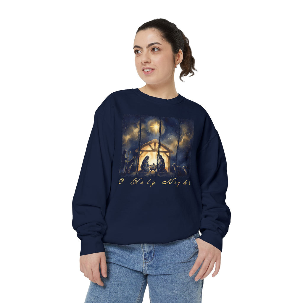 Christian Christmas sweatshirt with a painted nativity of Mary, Joseph and the manger in a glowing stable under a bright star, with O Holy Night in script.