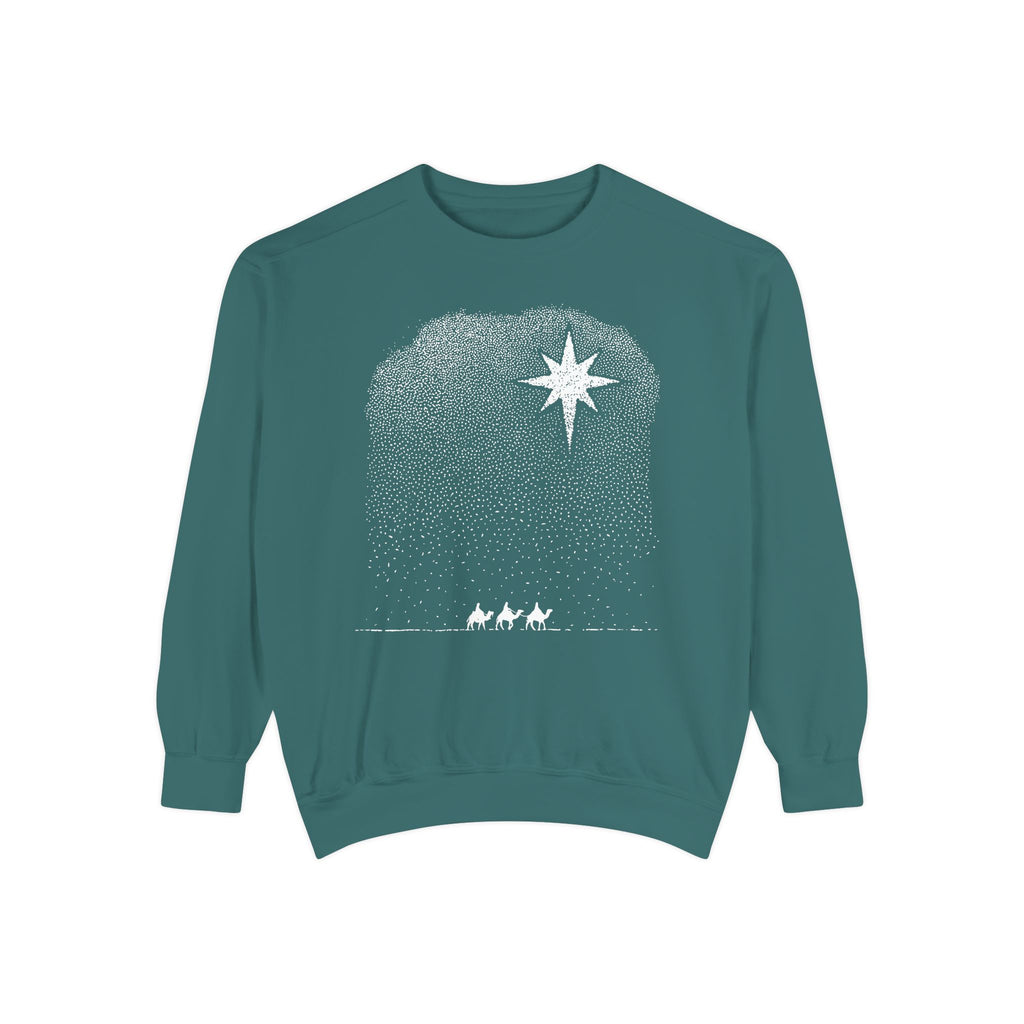 Blue Spruce Christian Christmas sweatshirt with a bright star over a stippled night sky and three wise men riding camels along the horizon.