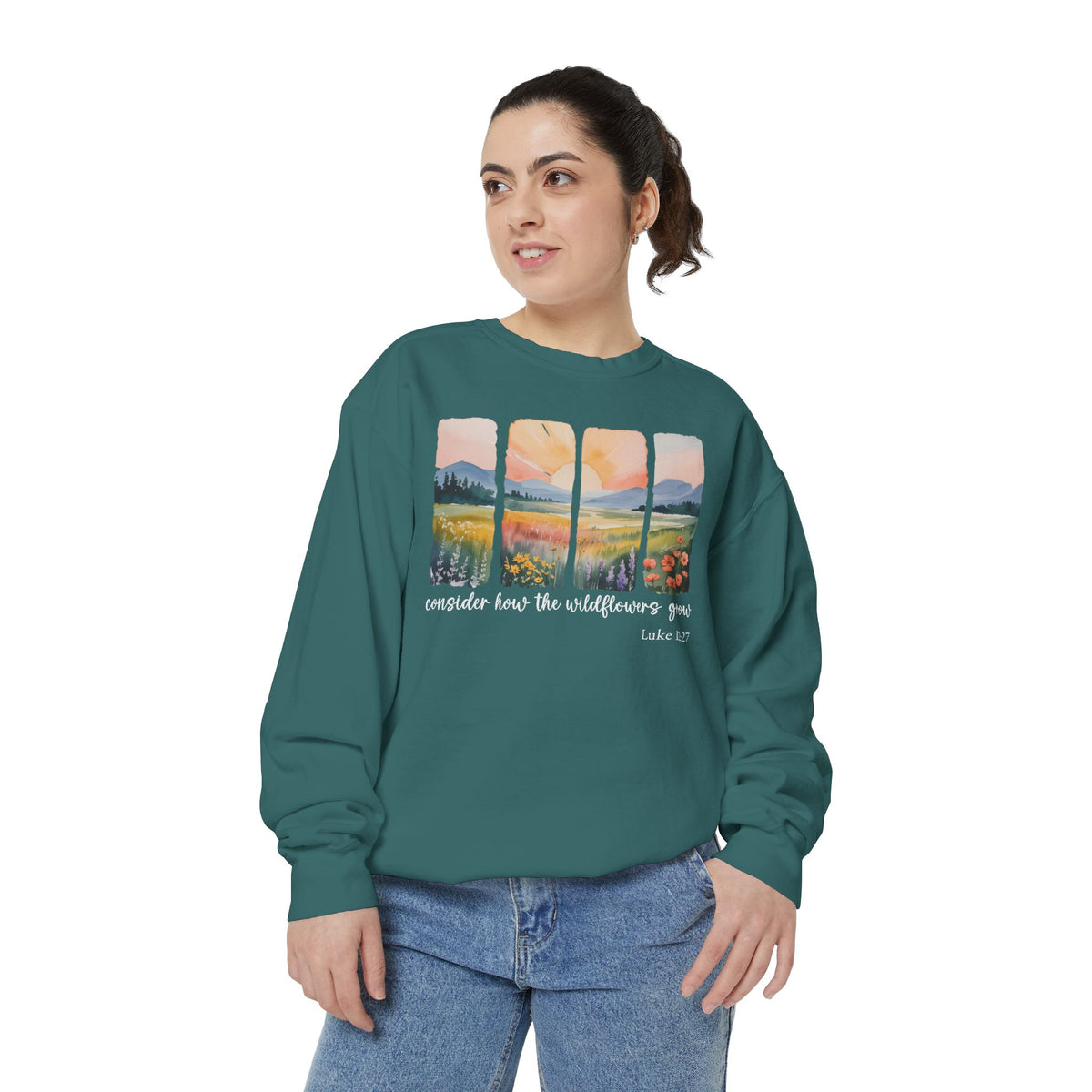 Christian sweatshirt with four painted panels of sunrise over hills and a wildflower meadow, reading consider how the wildflowers grow, Luke 12:27