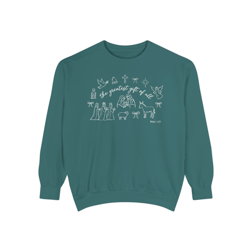 Blue Spruce Christian Christmas sweatshirt with the greatest gift of all script and line art of the holy family, wise men, a donkey, a lamb, an angel, a dove, a cross and Matthew 1:21.
