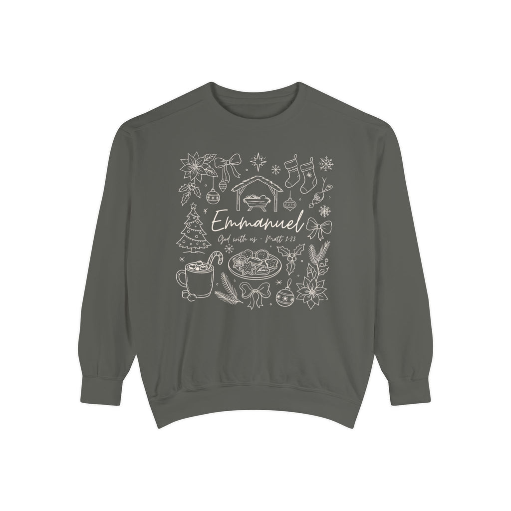 Pepper Christian Christmas sweatshirt with Emmanuel God with us script and Matthew 1:23 surrounded by doodles of a manger, stockings, a tree, cocoa and cookies.